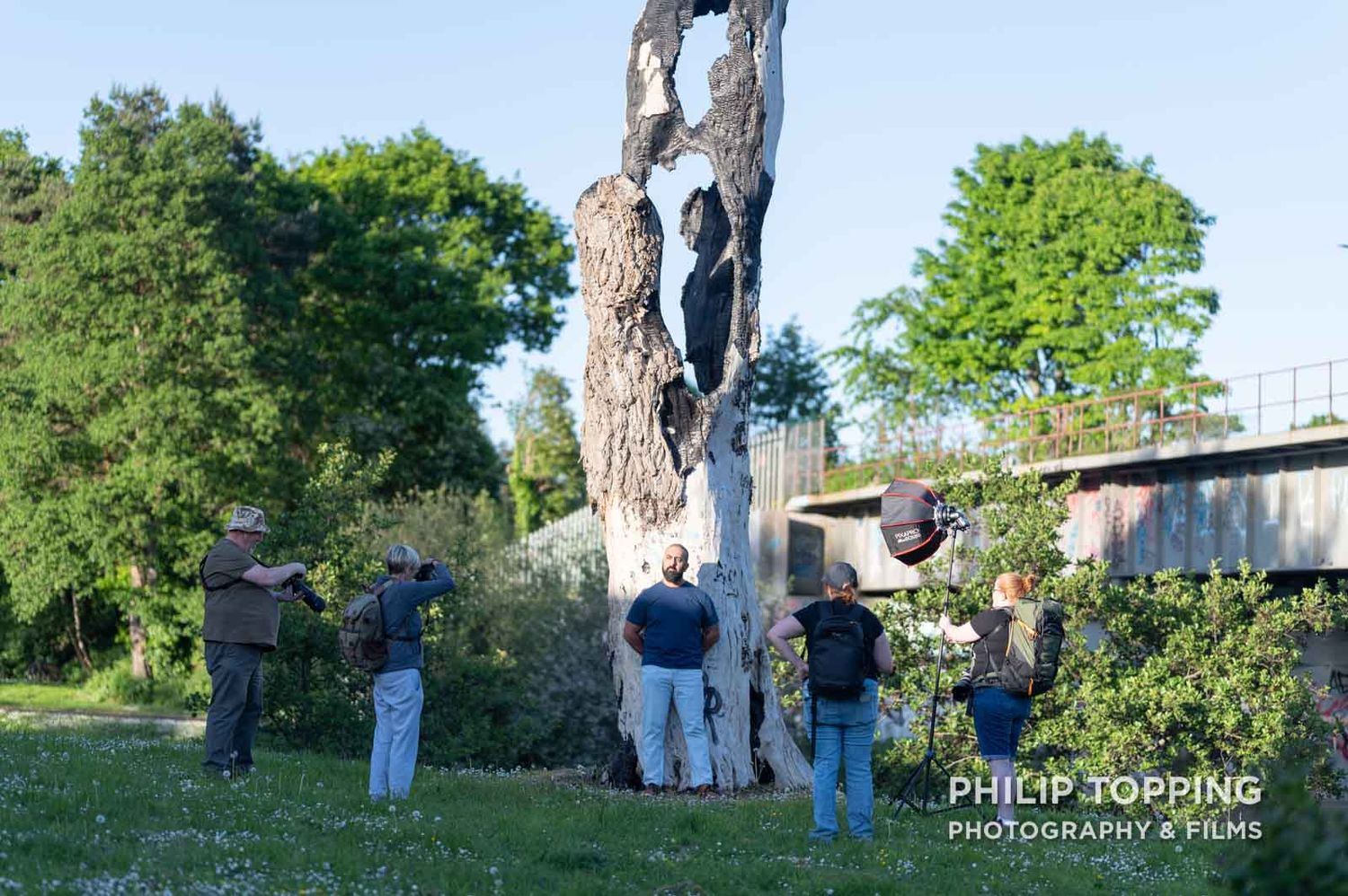 Members of the photo club with a model for a portrait beside the River Bann.