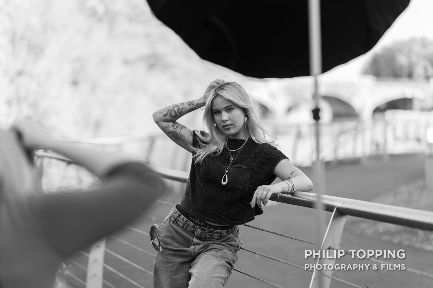 Female model with a soft box in front of her for lighting.