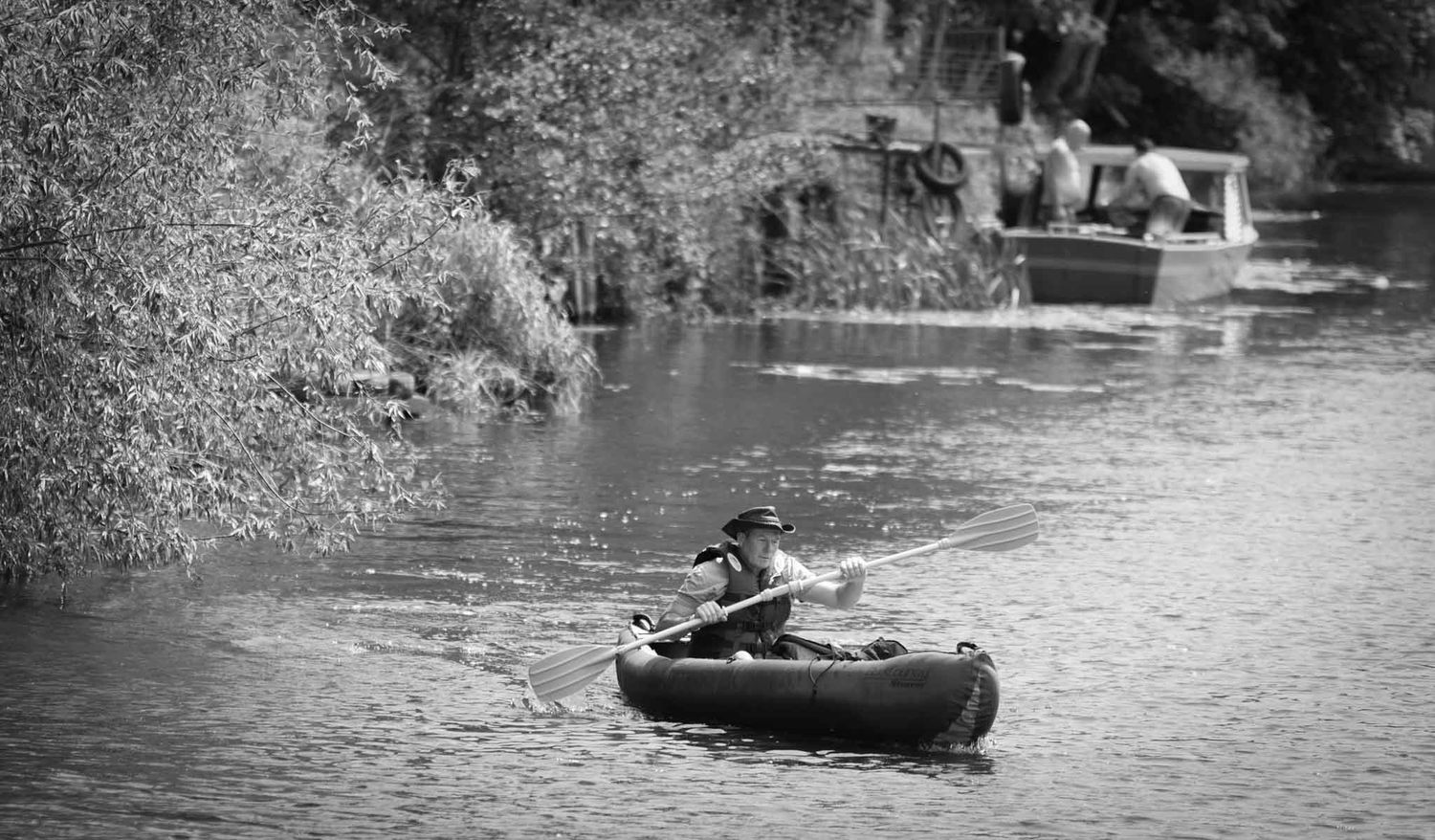 Canoeist paddling on the river.