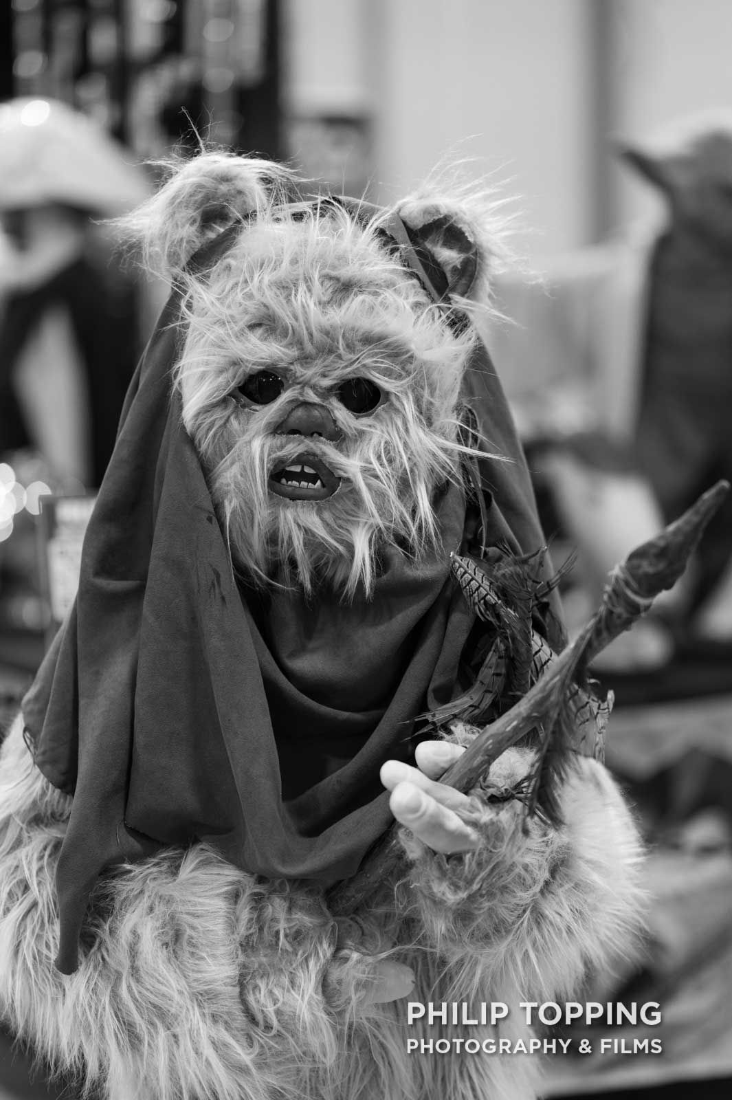 A young person or child dressed as an Ewok from Return of the Jedi.