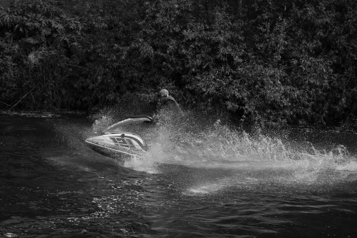 A jet skier is having fun in the summer.