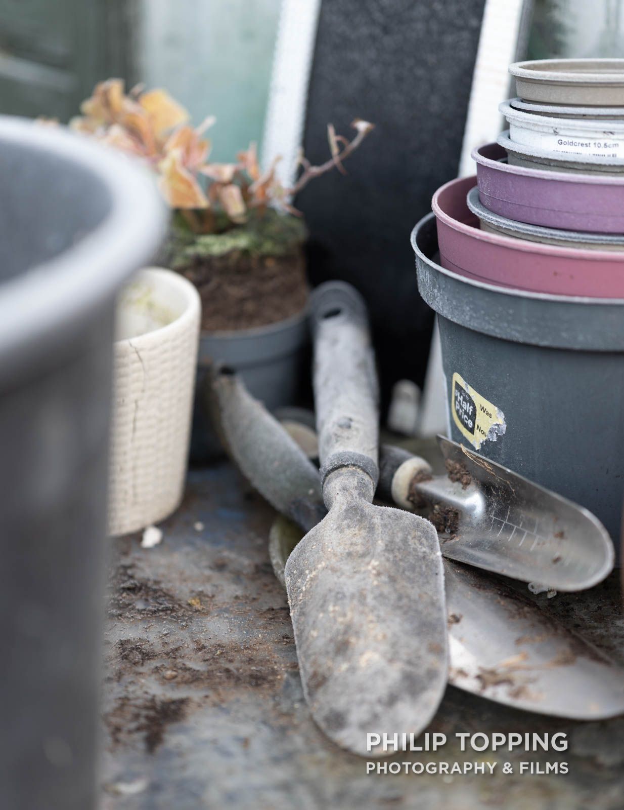 Gardening hand trowels and pots frozen.