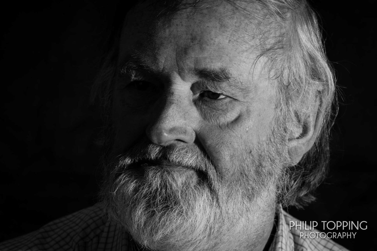 Close-up of a male portrait in mono.