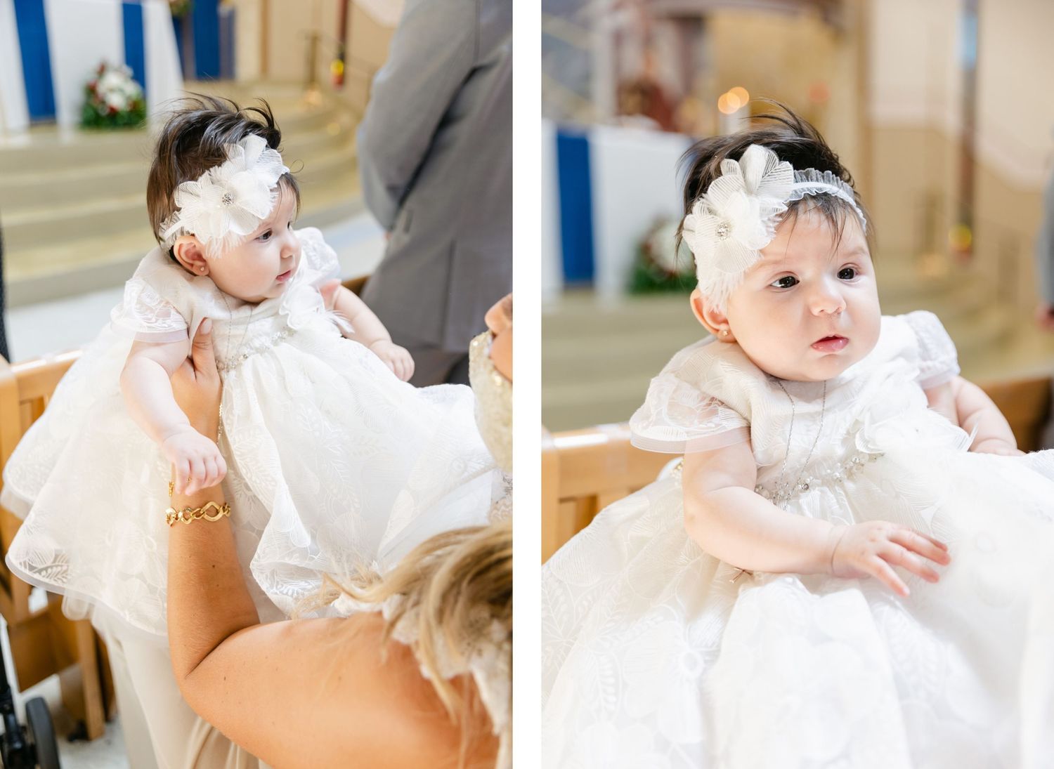 Baby wearing white christening gown and headband sitting in tan chair.
