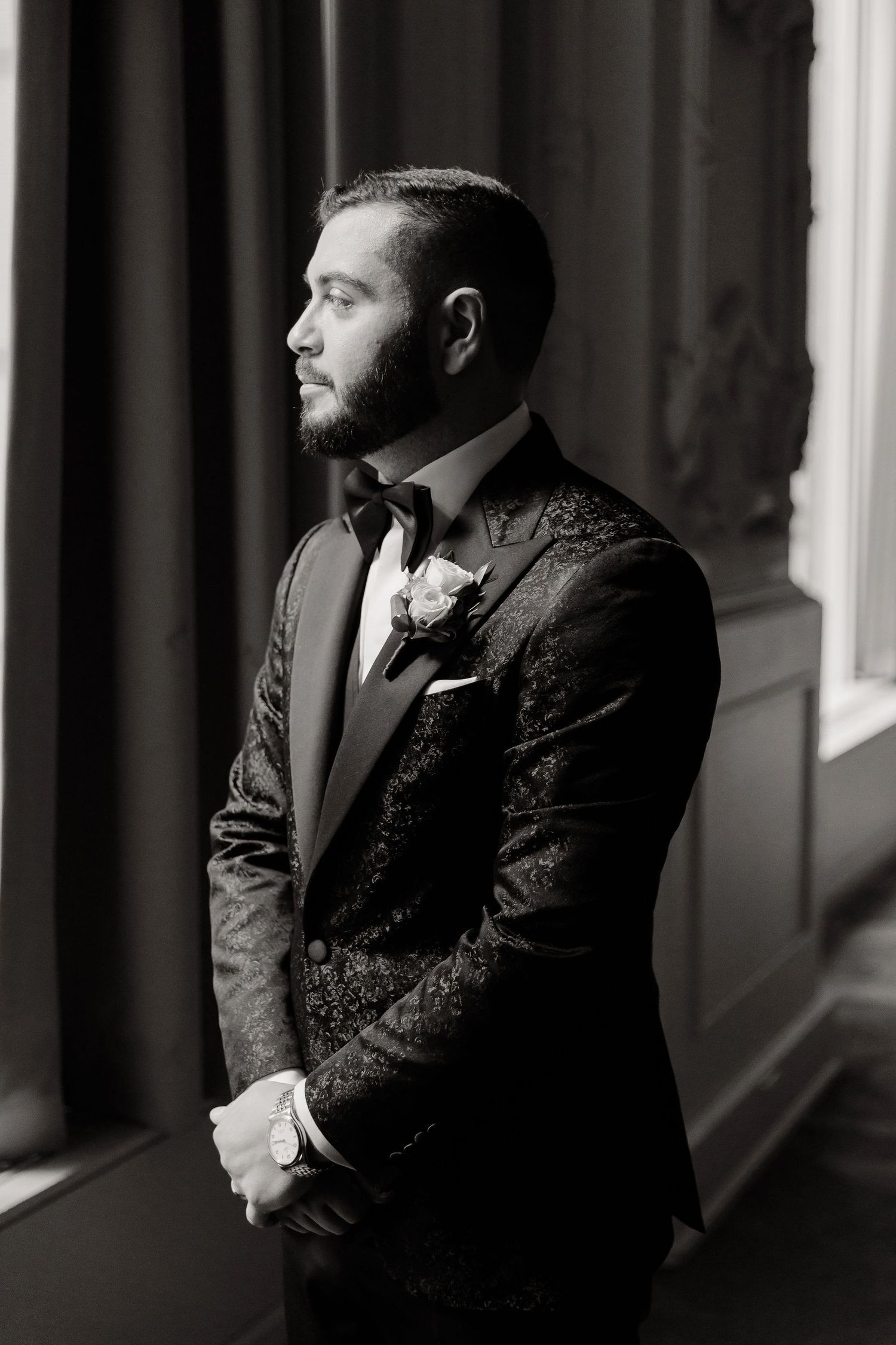 A black and white portrait series showing a bearded man in formal attire looking thoughtfully to the side.