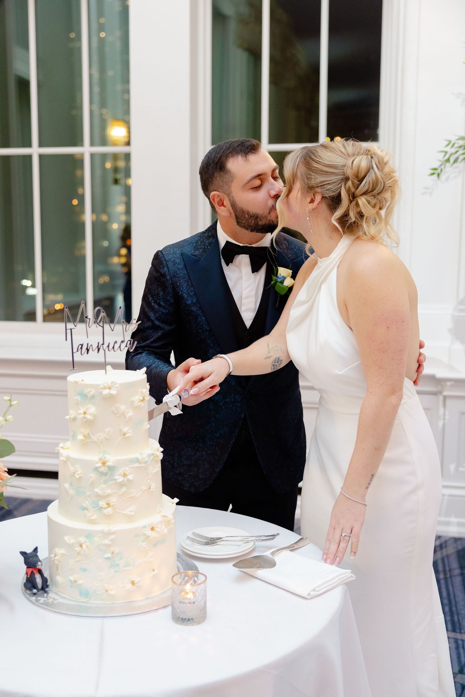 Romantic sequence of a couple sharing their first bite of wedding cake together at an elegant reception.
