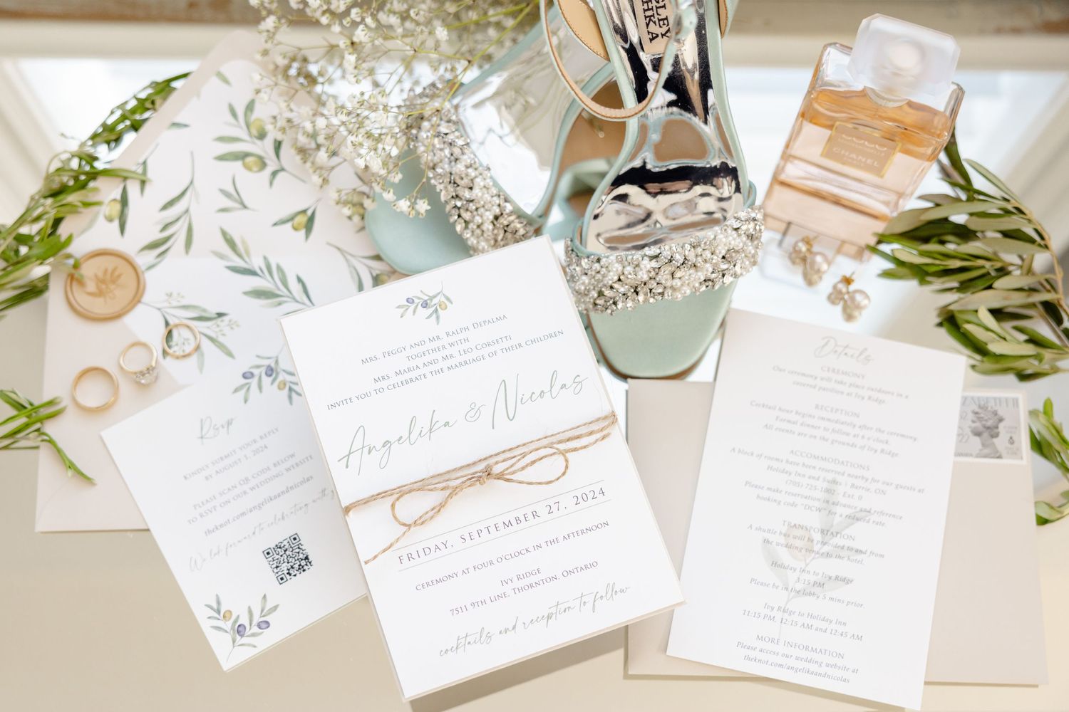 Wedding invitation suite with botanical designs, twine details, and mint green accents.