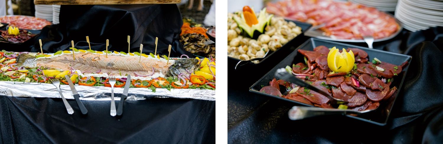 Catering spread at an event with food platters and dishes arranged on tables.