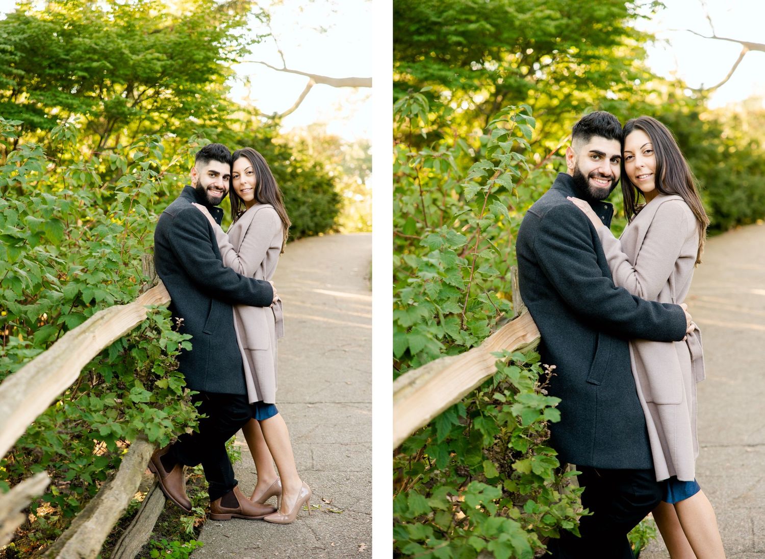 Couple in elegant winter coats embracing near a wooden rail in a garden setting.