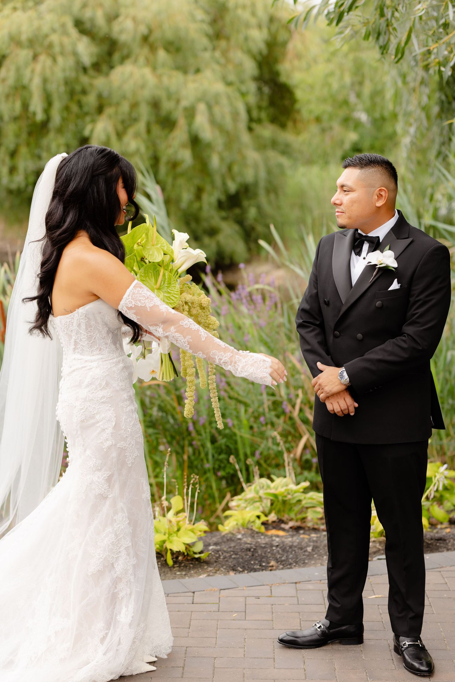 A sequence of romantic wedding moments showing a couple dancing and twirling together on paved brick pathway in a garden setting.