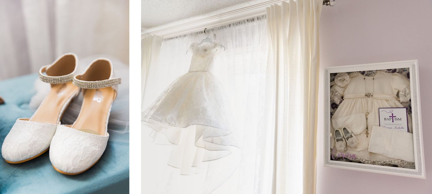 Wedding details flatlay with white shoes, dress, and frame against light background.