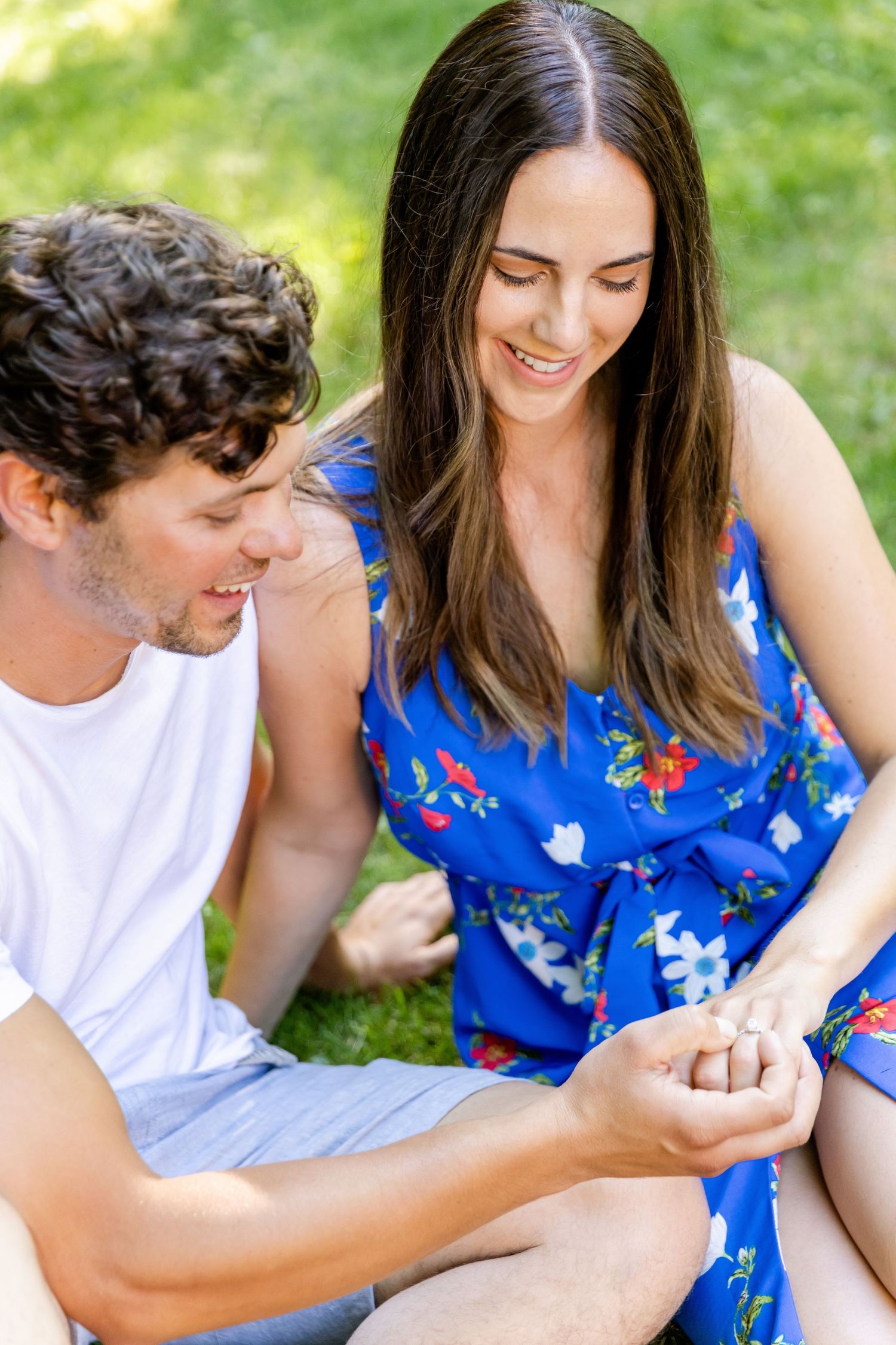 A romantic moment captured between a couple during their outdoor engagement photoshoot.