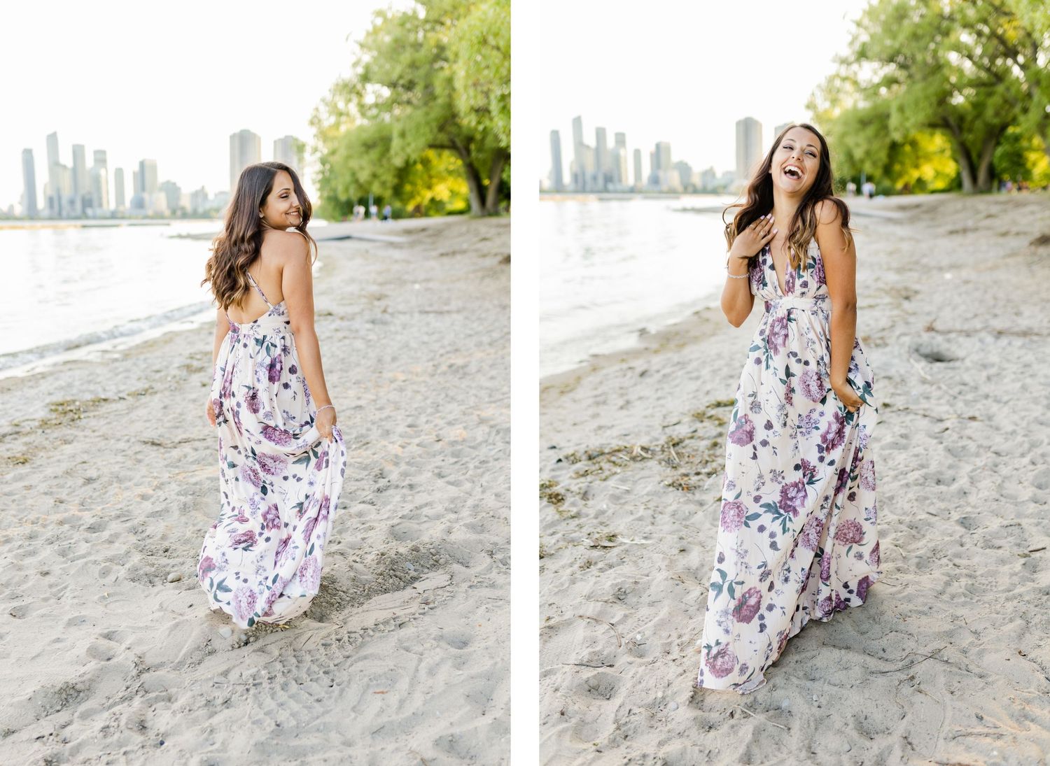 A woman in a white floral maxi dress twirls on a beach near the city.