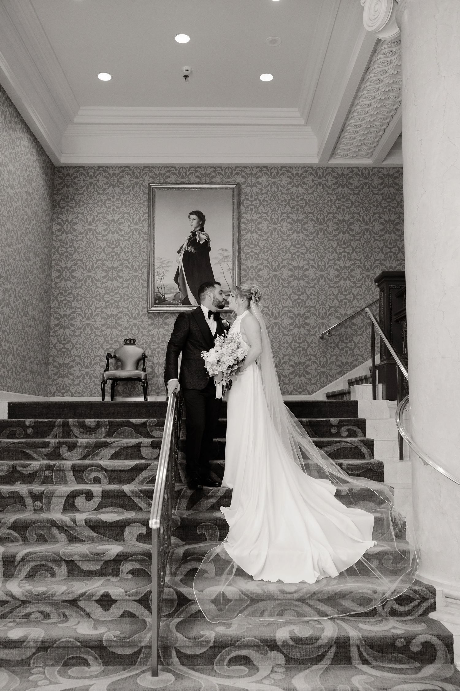 A series of wedding photos showing a couple descending an ornate staircase with patterned carpet.