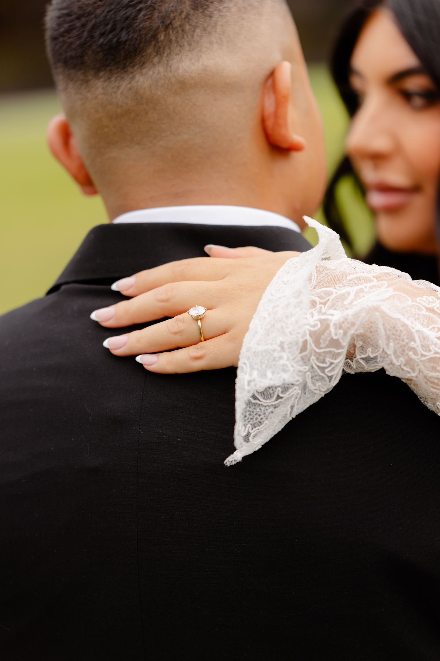 A series of wedding photographs showing lace sleeves and hands resting on dark formal attire.
