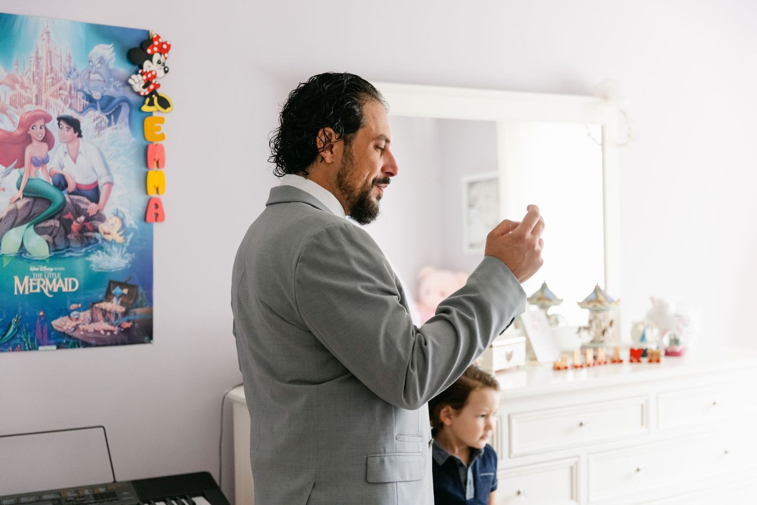 A joyful moment captured in a bright room with Disney decorations.