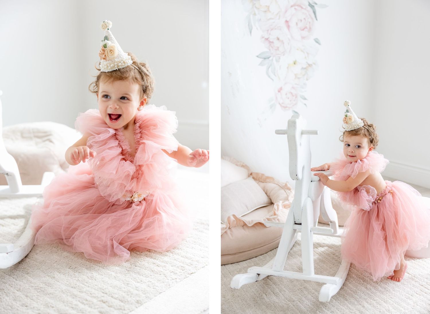 Pink party dress and cone hat outfit shown against white rocking horse in bright nursery setting.