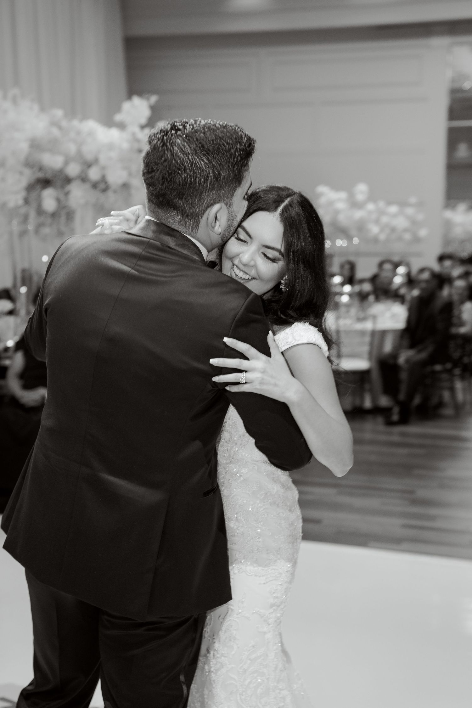 A tender black and white moment captured during the couple's wedding dance.