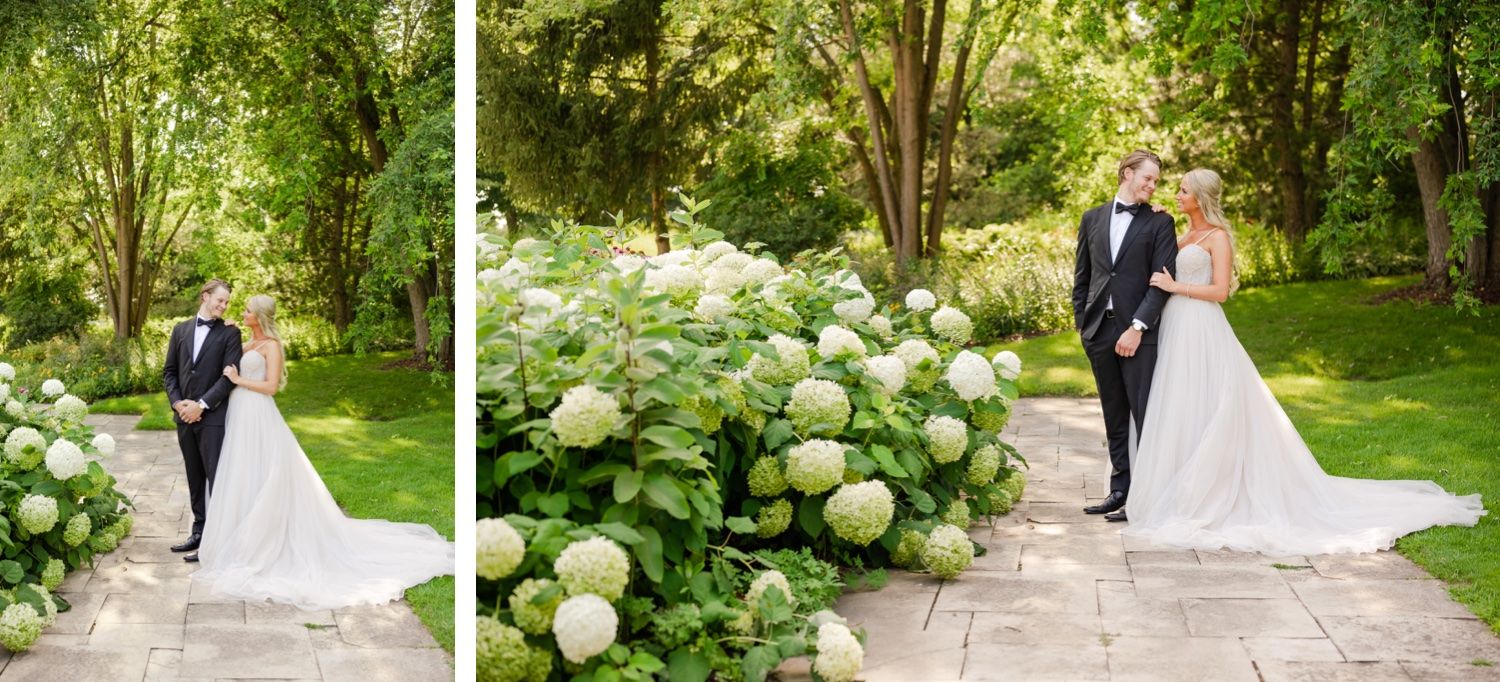 Beautiful garden wedding portraits featuring blooming hydrangeas and stone pathways.