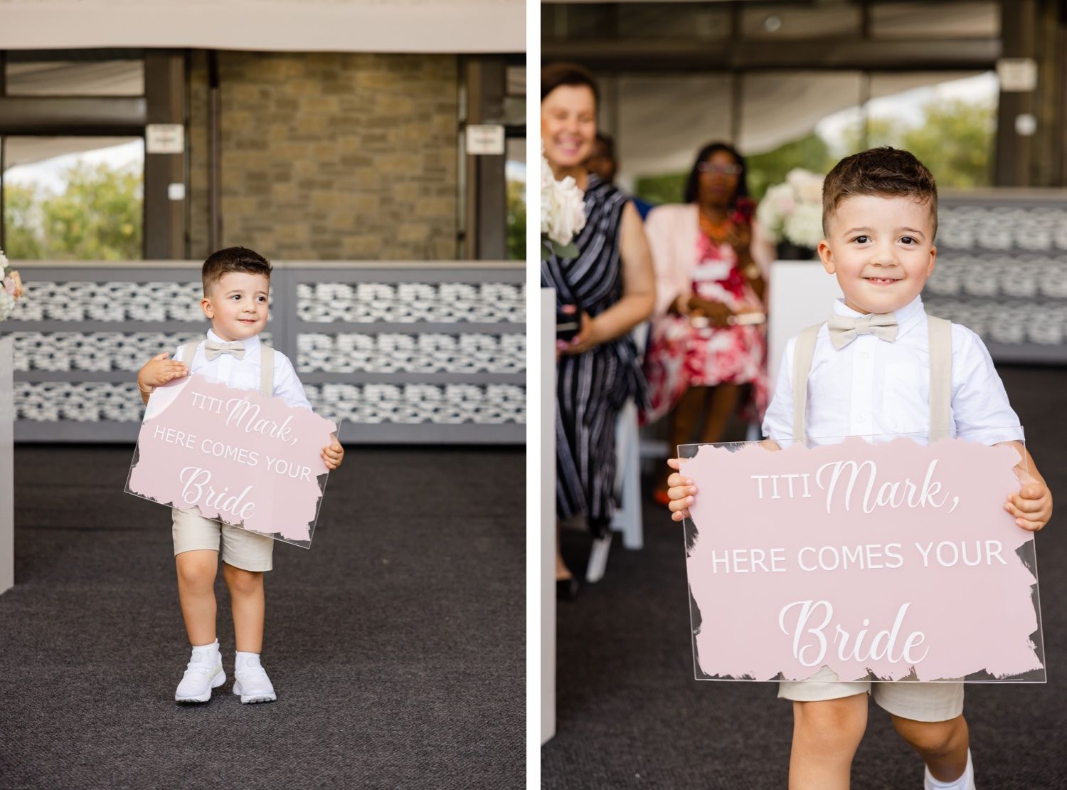 Young ring bearers holding pink wedding signs during ceremony procession.