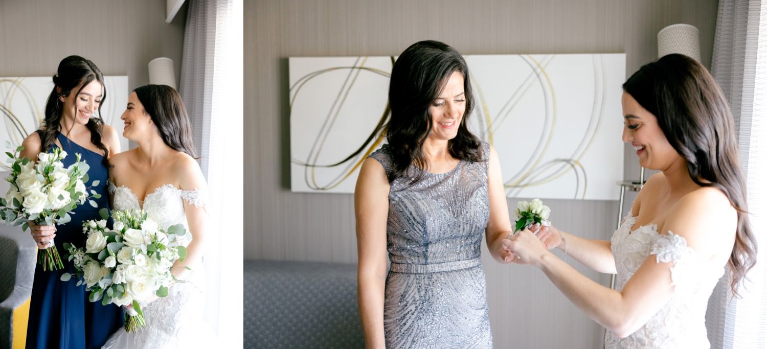 Wedding preparation scene showing elegant dresses in blue and white in a bright hotel room.
