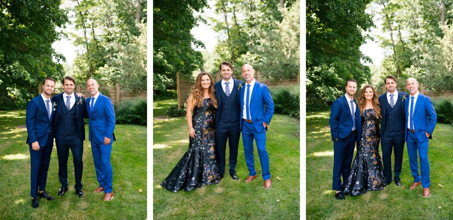 Group formal portraits in navy suits and black evening gown against garden backdrop.