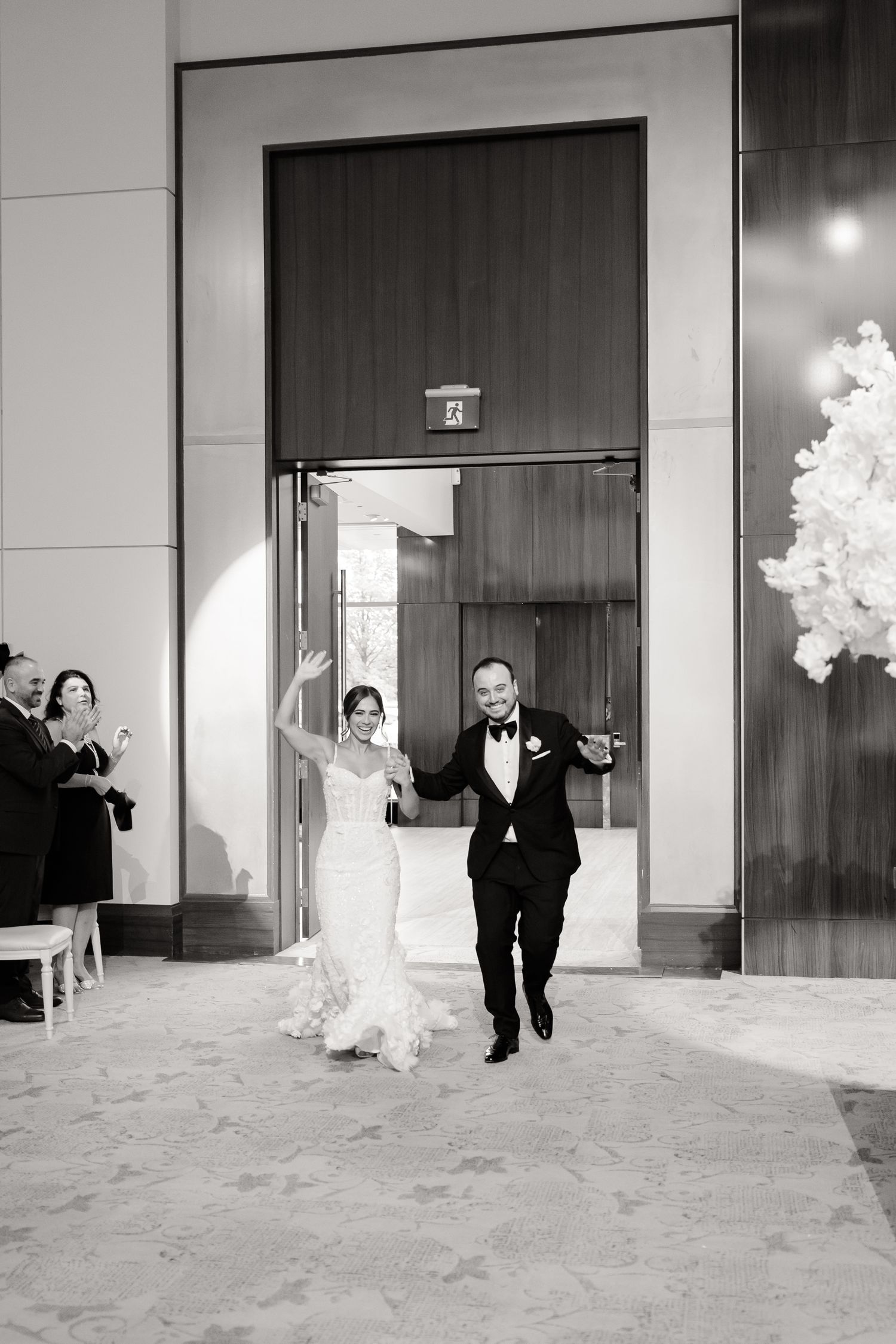 Sequence of wedding photos showing couple peeking through and emerging from behind elevator doors.
