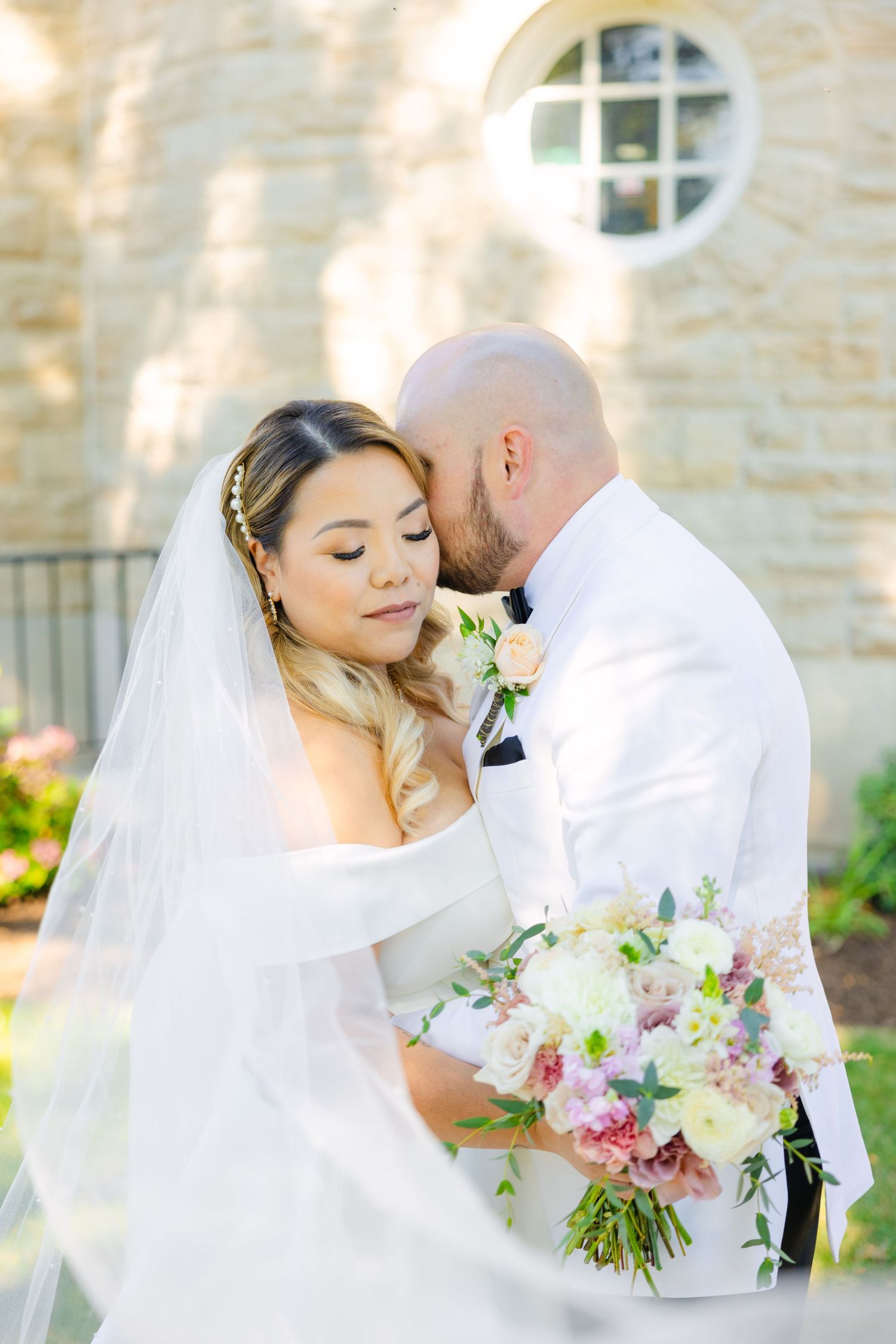 An intimate wedding moment captured with soft lighting and elegant floral details.