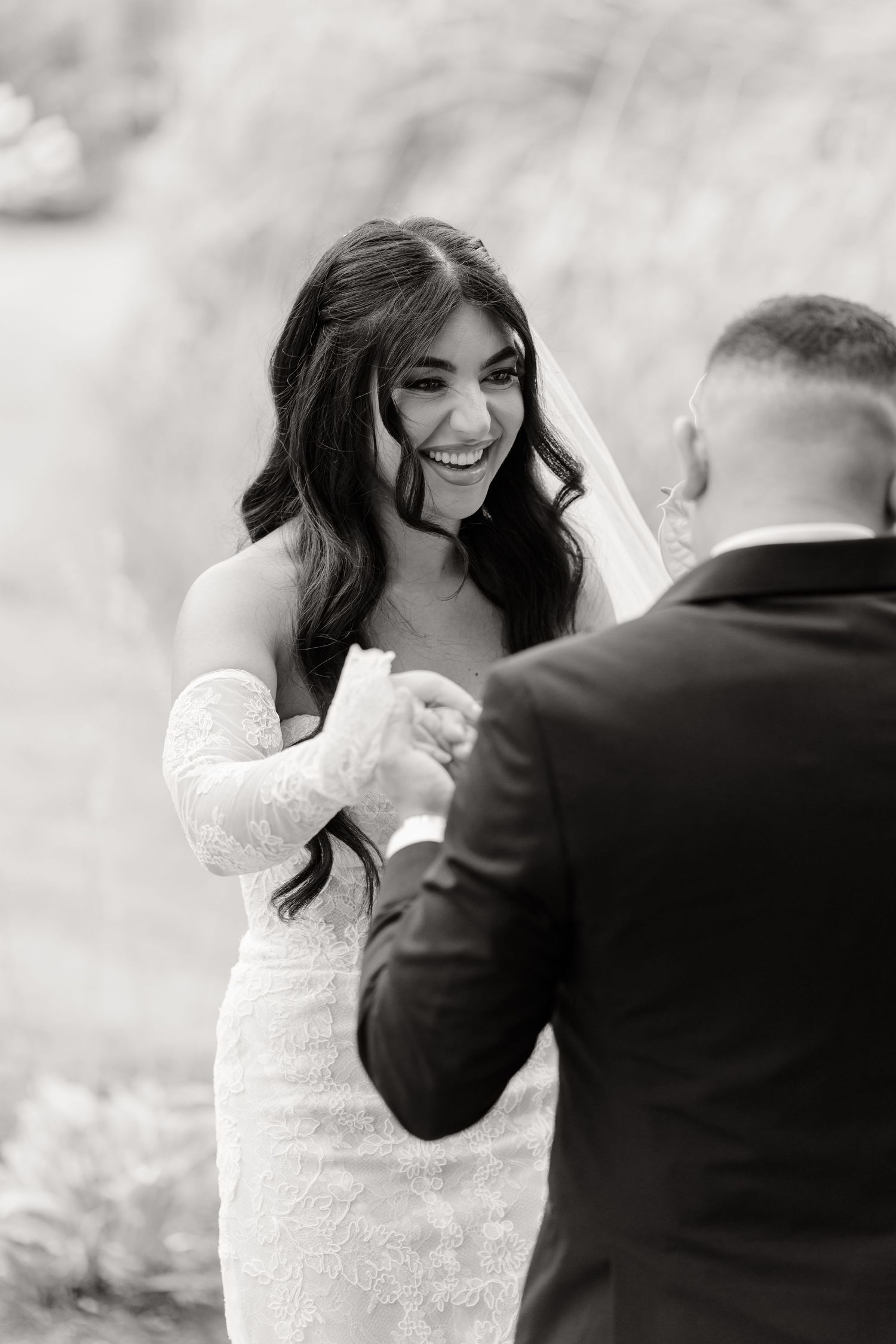 A bride and groom share joyful moments in a series of black and white wedding photos showing their playful interaction.