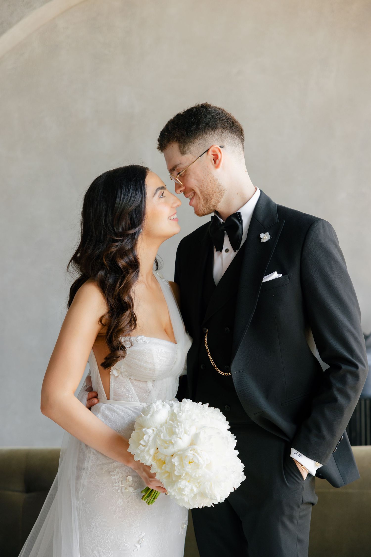 Intimate moment between newlyweds during their wedding portrait session.