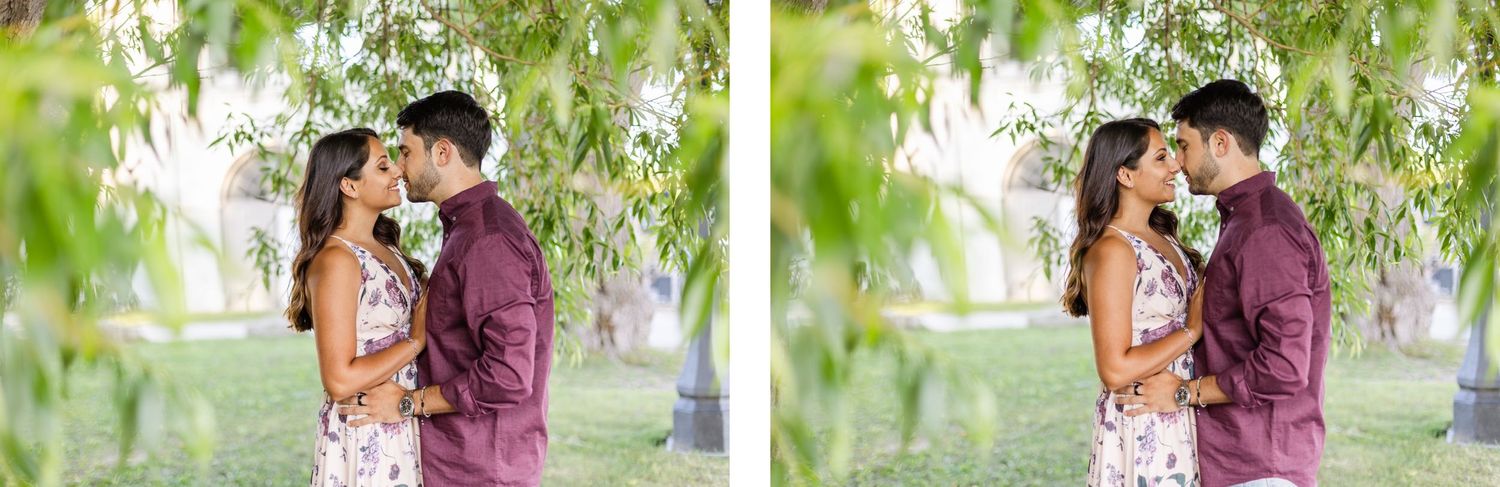 Romantic couple portrait beneath willow trees in burgundy and floral attire.