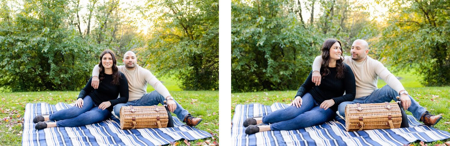 Couple enjoying picnic on blue and white blanket with wicker basket in park setting.