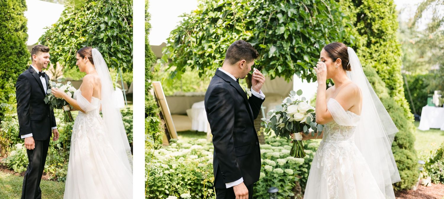 Emotional wedding first look moment captured in a lush garden setting.