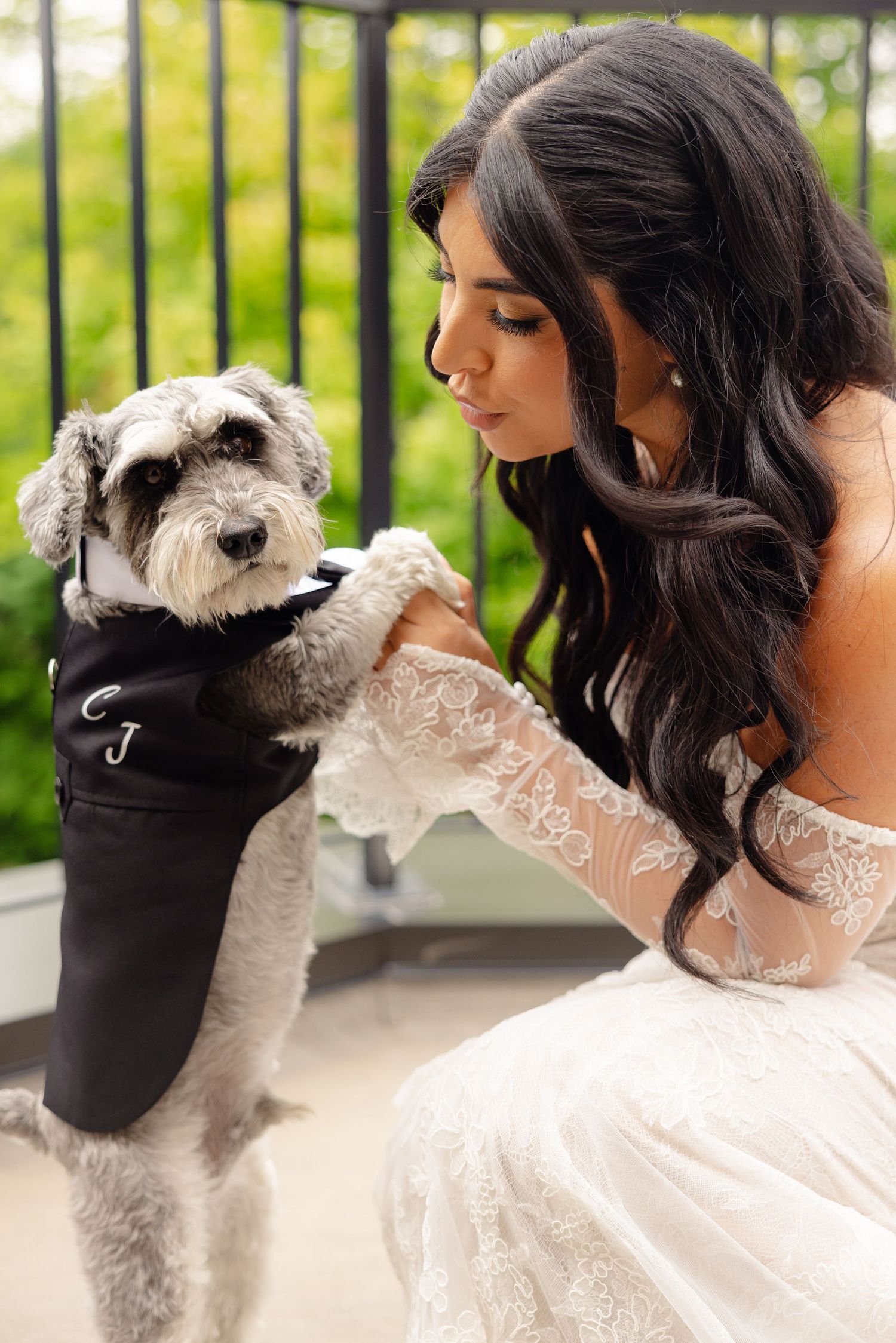 A sequence of tender moments between a woman in a white lace dress and her fluffy white dog.