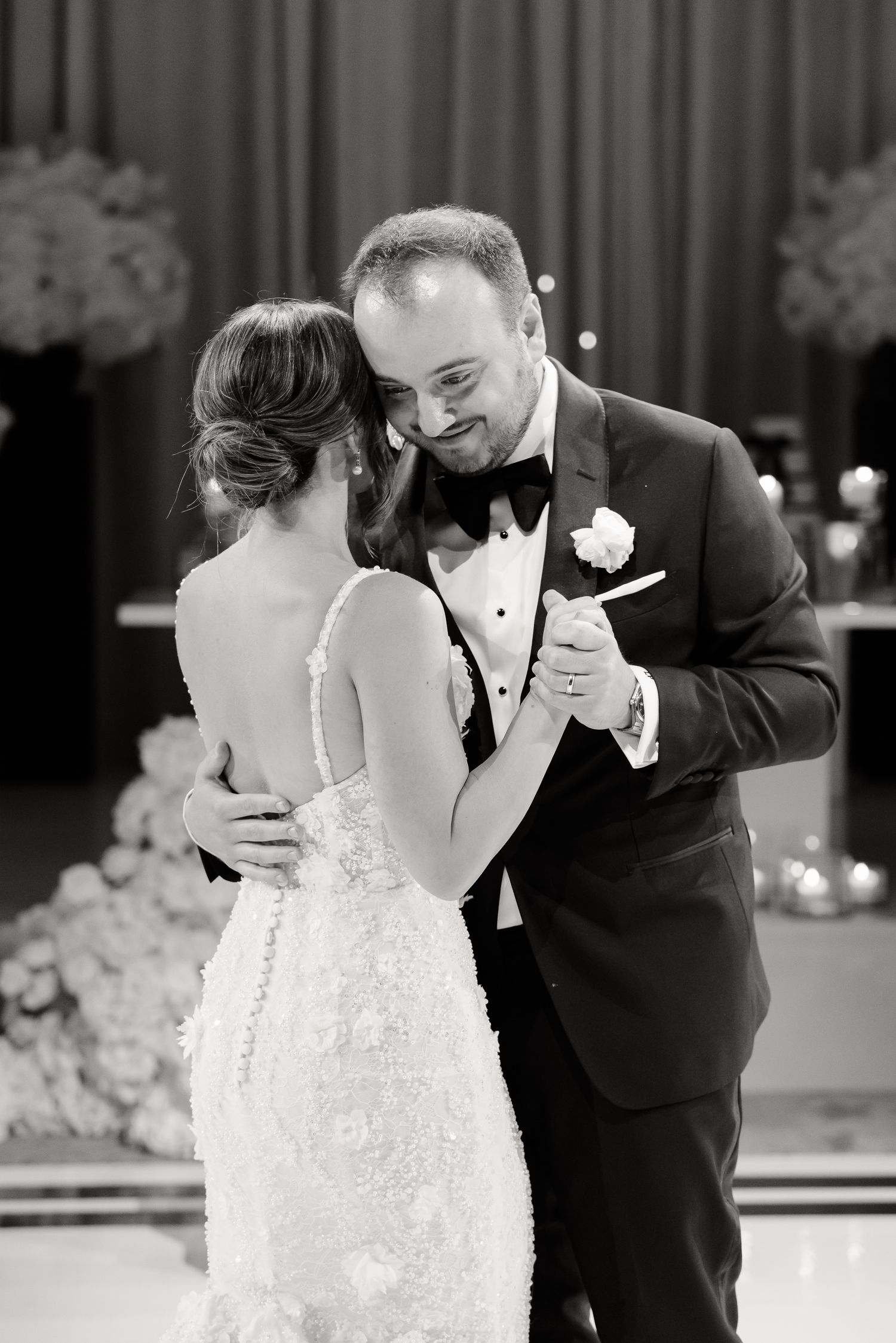 The couple shares their first dance at their wedding reception in a sweet candid moment sequence.