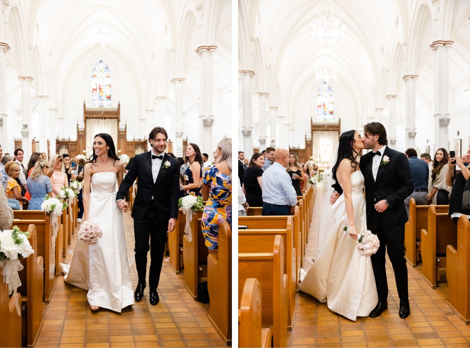 A couple exits their wedding ceremony while guests smile from church pews.