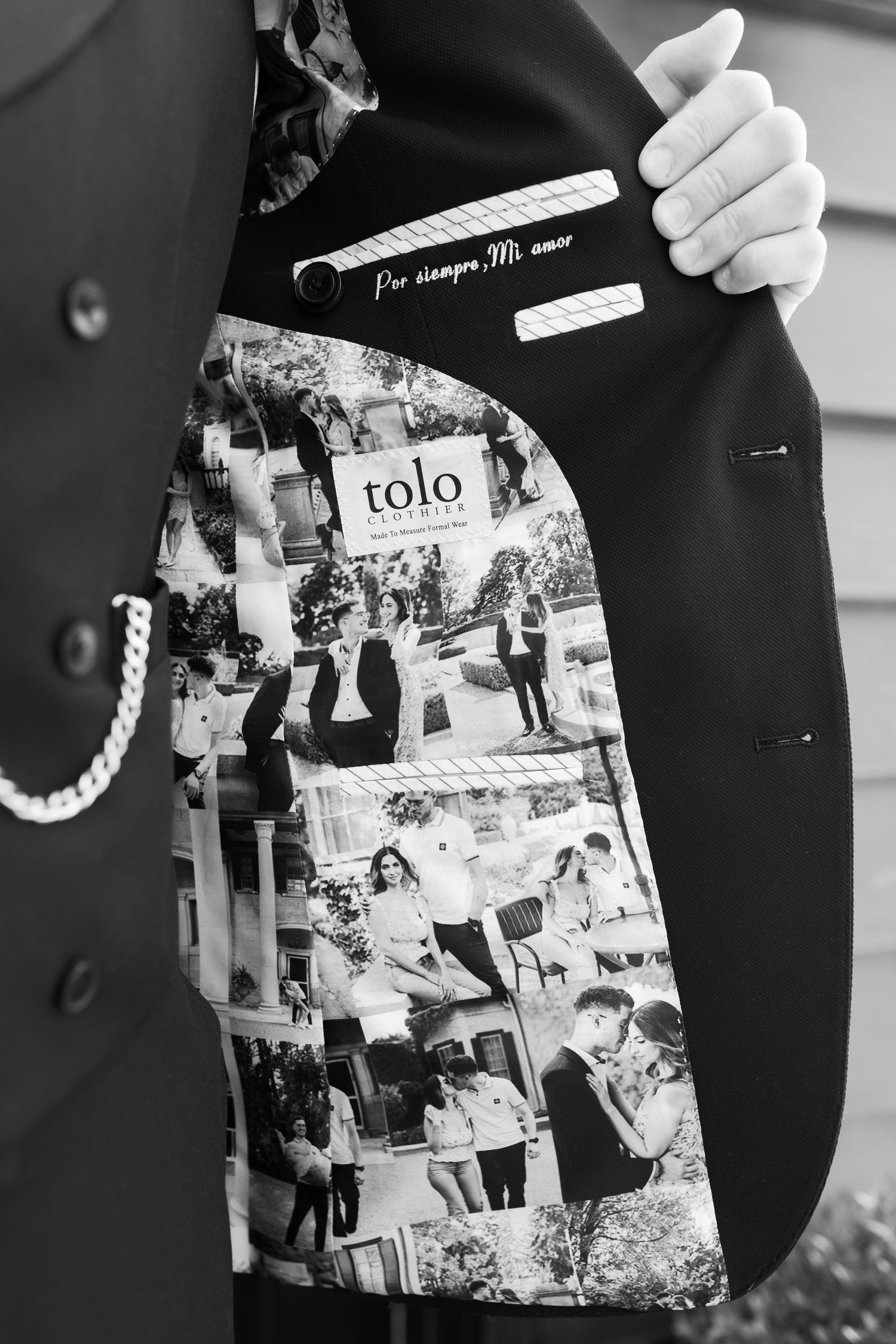 Black and white photo showing the custom lining of a tuxedo jacket with vintage photographs.