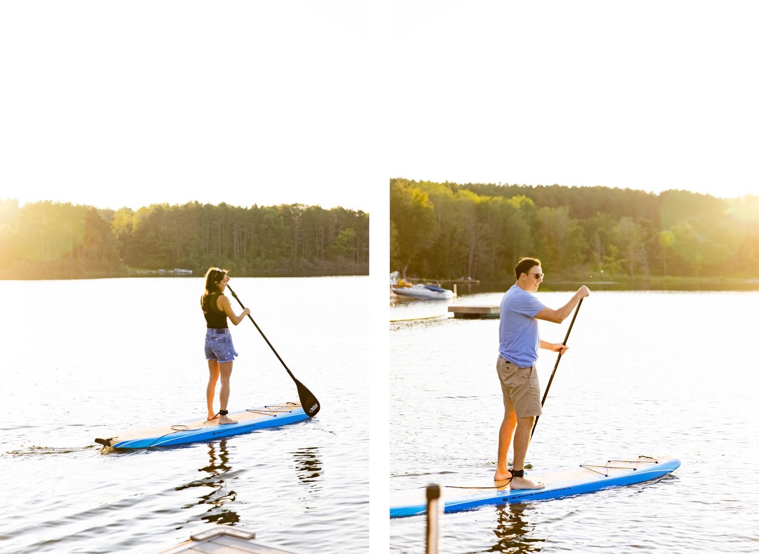 Two people paddleboarding on calm lake at sunset.