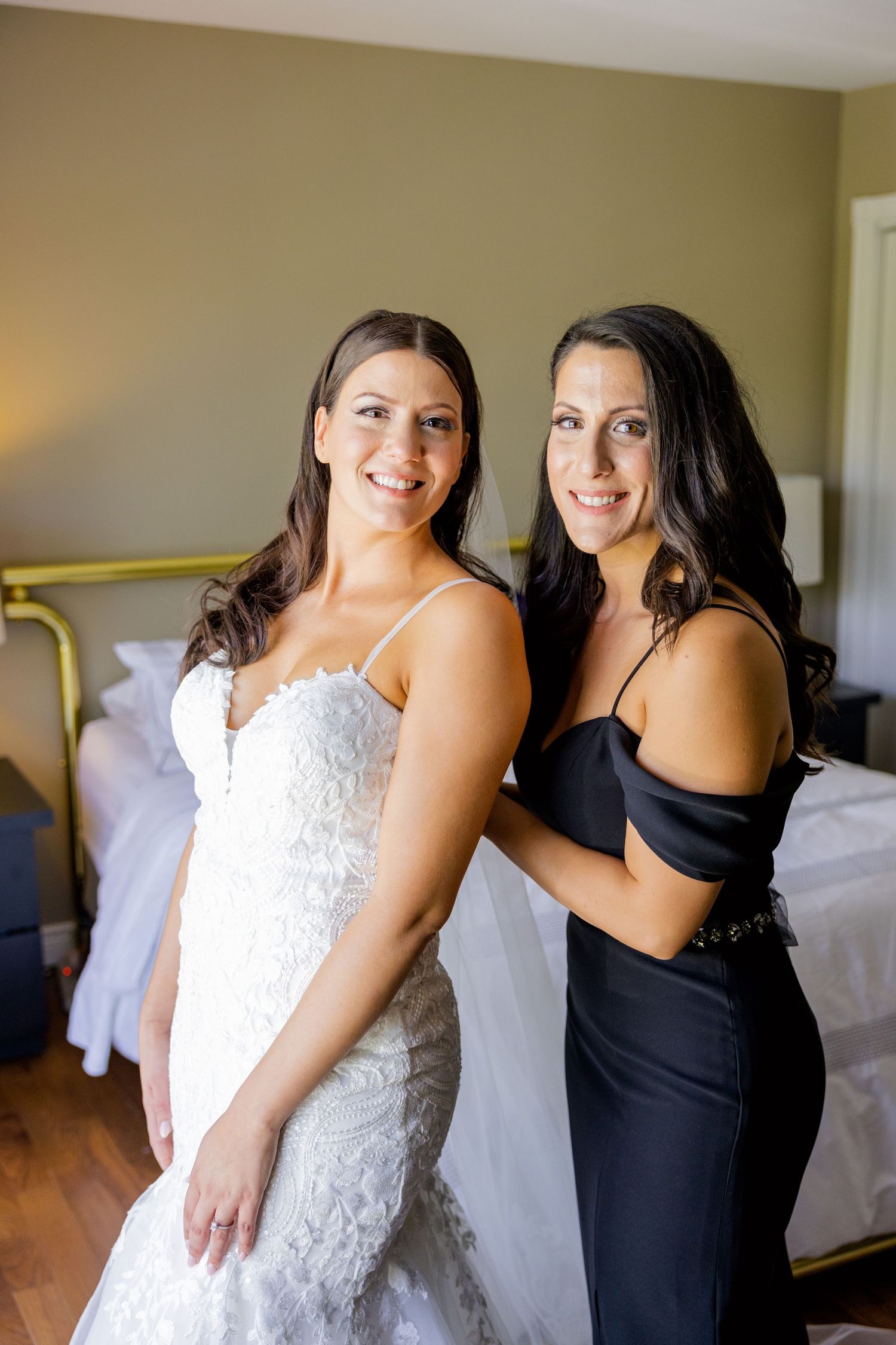 A bridal preparation scene in a bedroom with warm lighting.