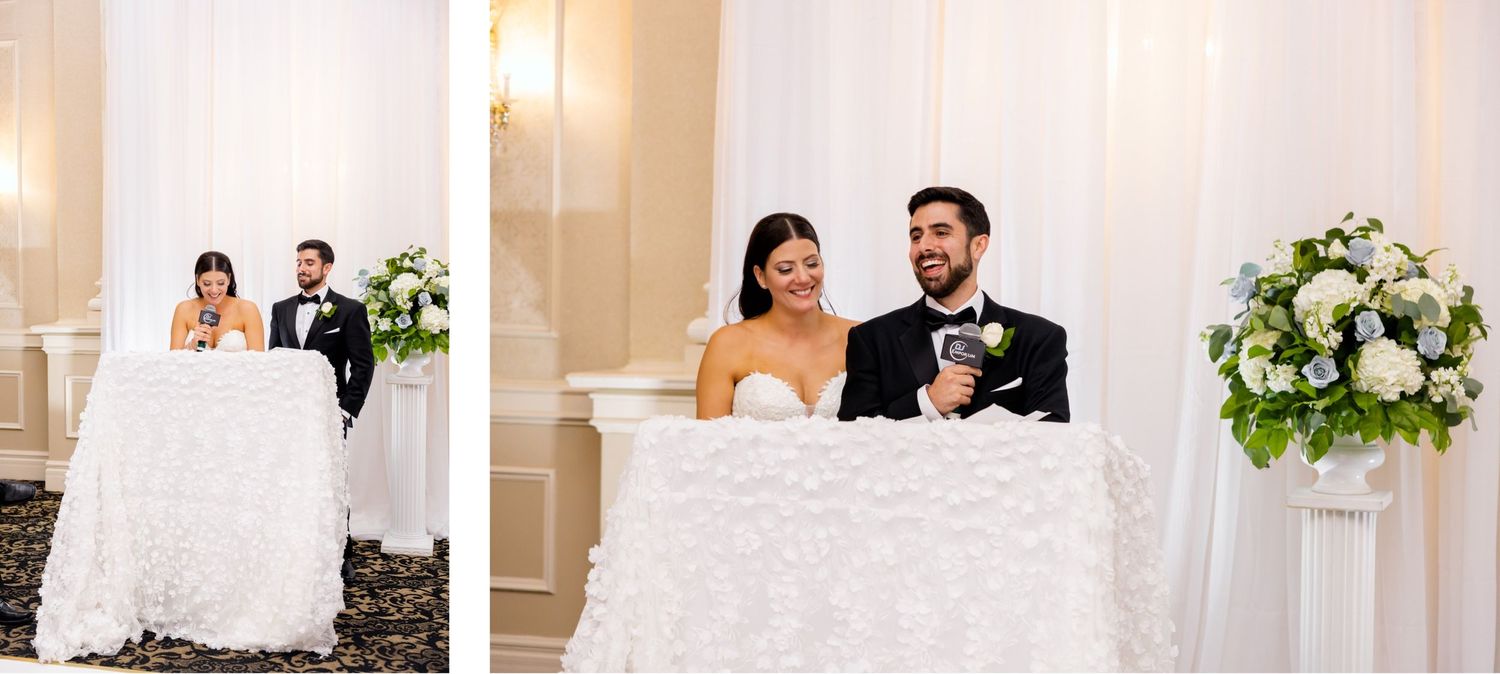 Wedding reception sweetheart table setup with elegant white decor and floral arrangements.