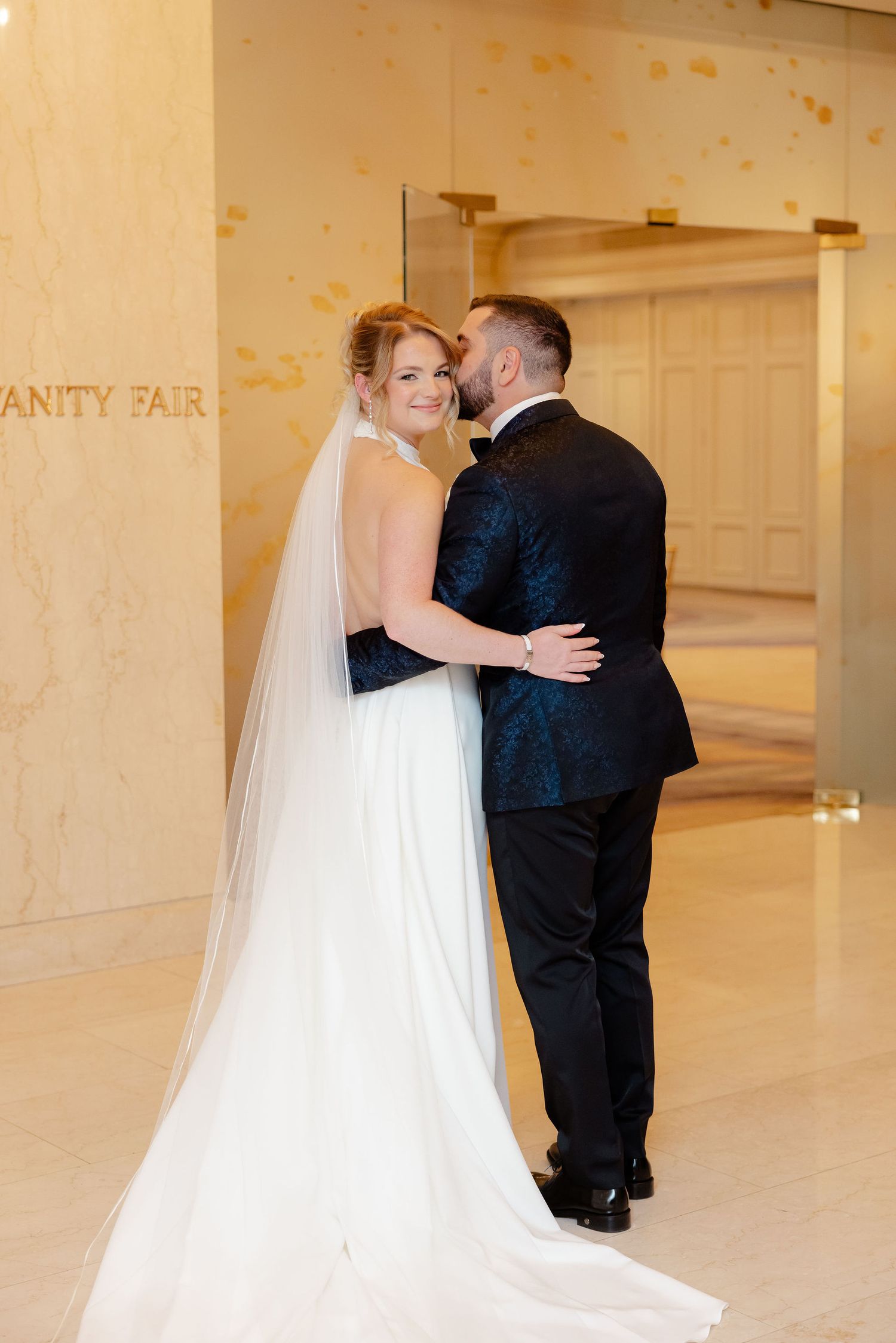A series of intimate wedding photos showing a couple embracing in a grand venue with white columns.