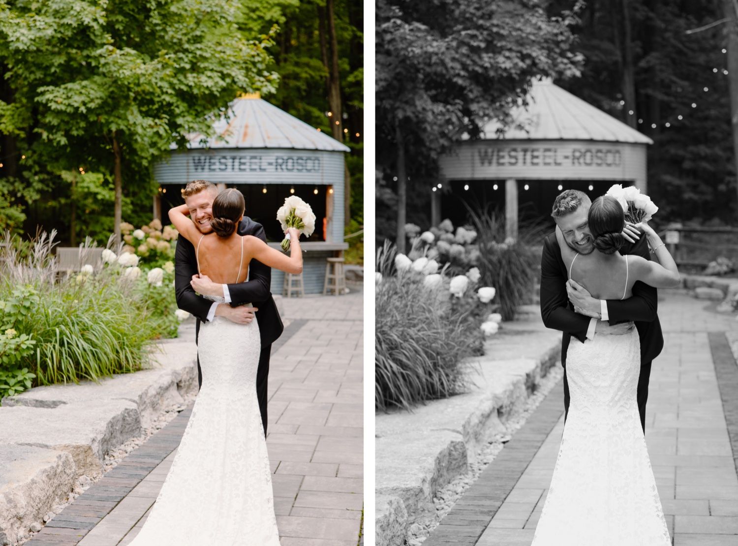 Romantic wedding couple embraces on a garden pathway with a rustic venue backdrop.