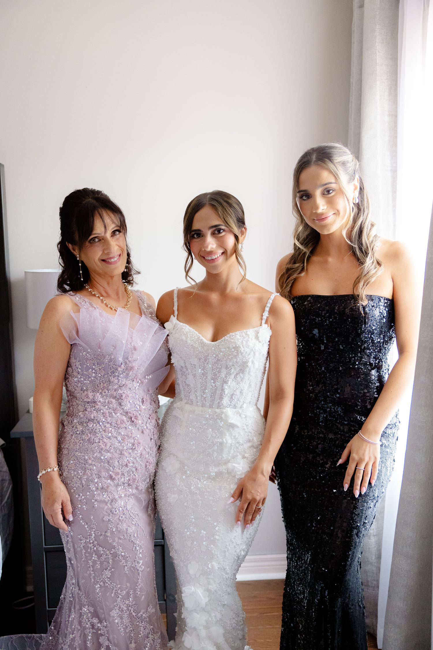 Four sequential photos of bridal party members posing together in elegant sequined gowns in lavender, white and navy colors.