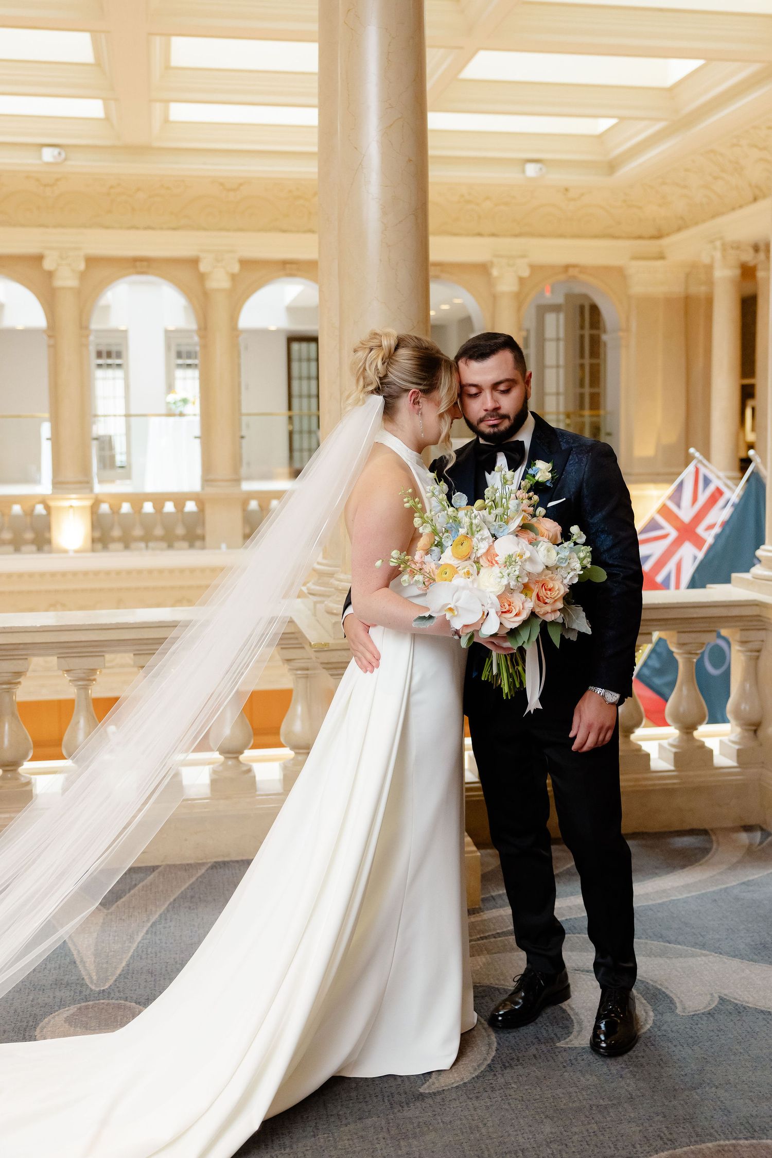 A romantic wedding photo sequence showing tender moments between newlyweds in a pillared hallway.