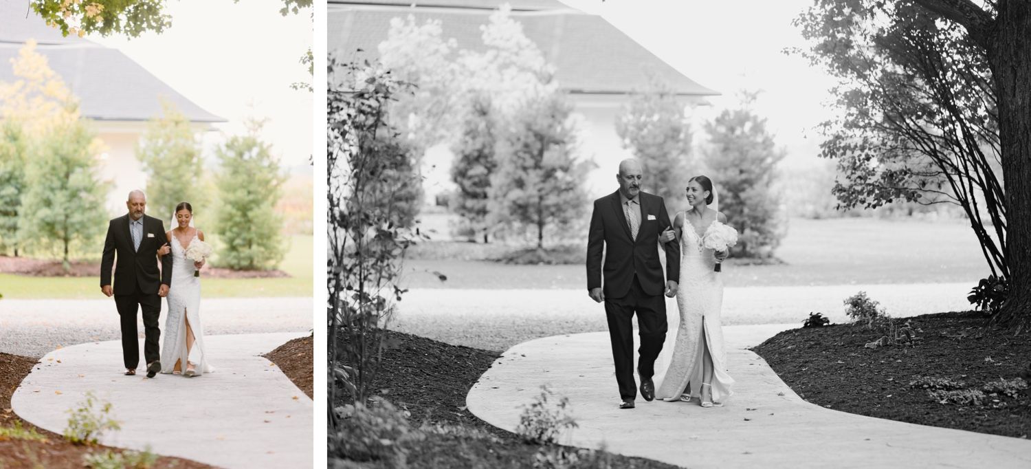 Wedding party strolls along winding pathway surrounded by lush landscape.