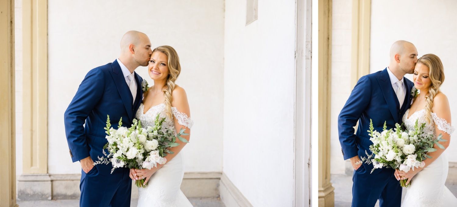 Romantic wedding portraits with white florals against neutral architectural backdrop.