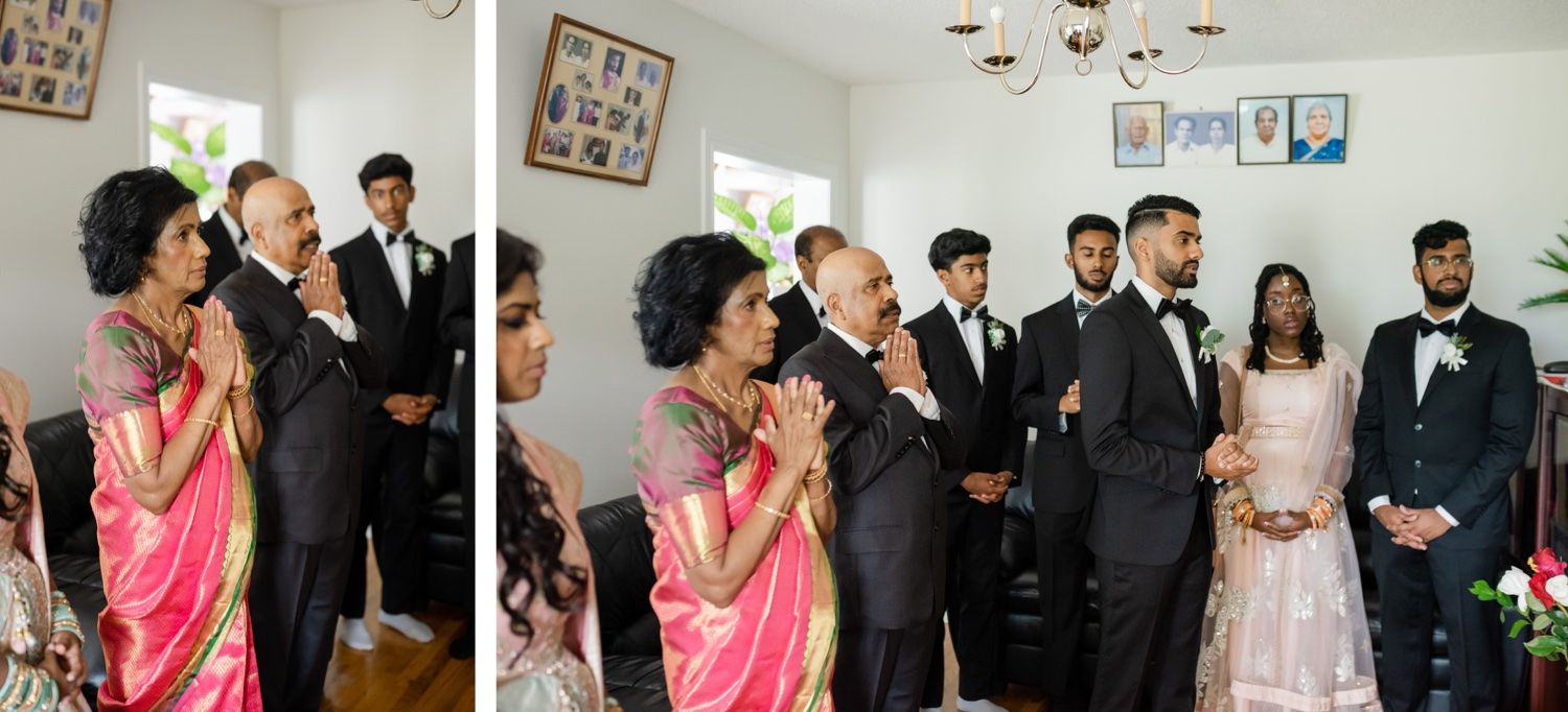 Wedding celebration with guests in traditional attire sharing joyful moments indoors.