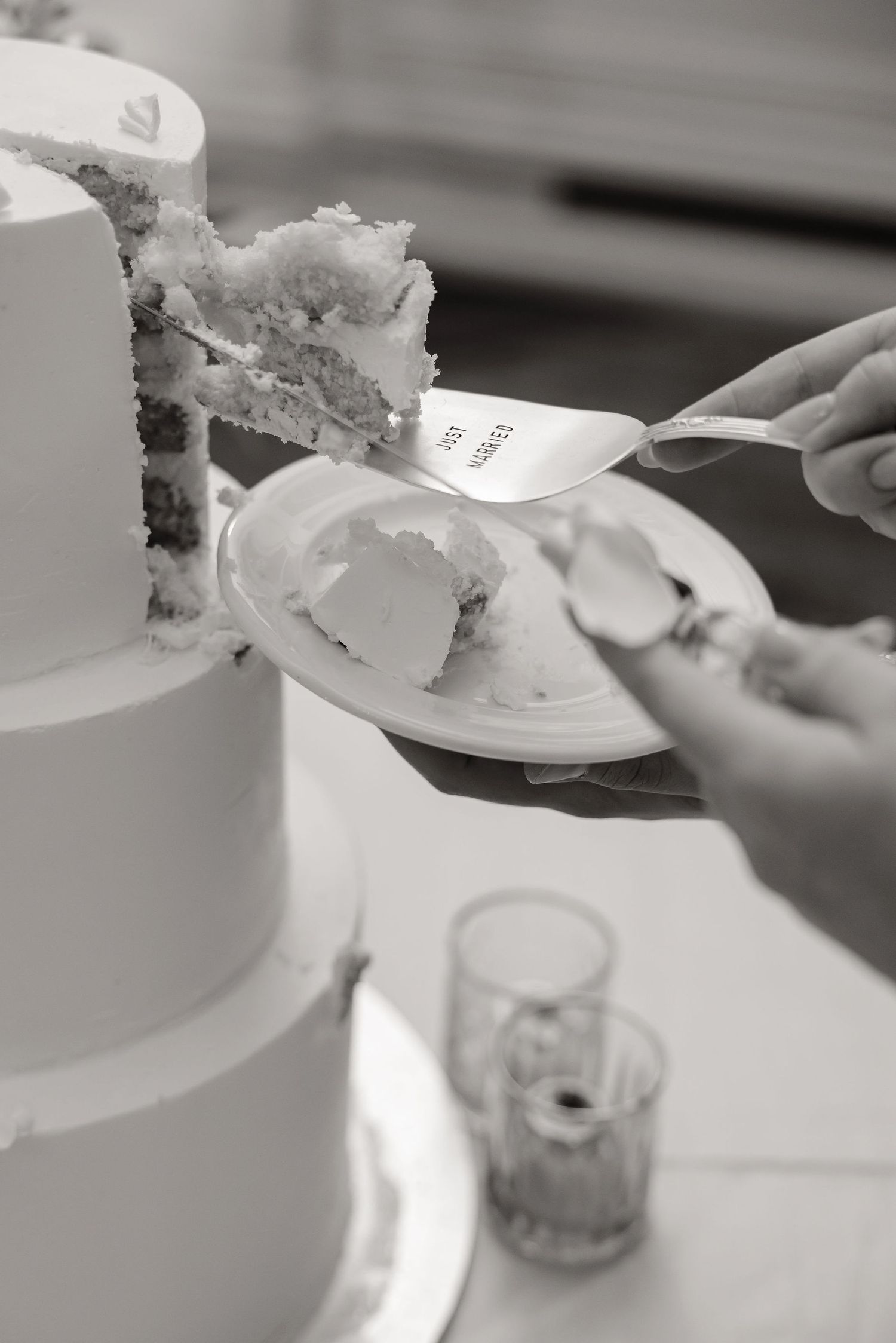 Close-up shots of wedding cake being cut and served at an elegant reception.