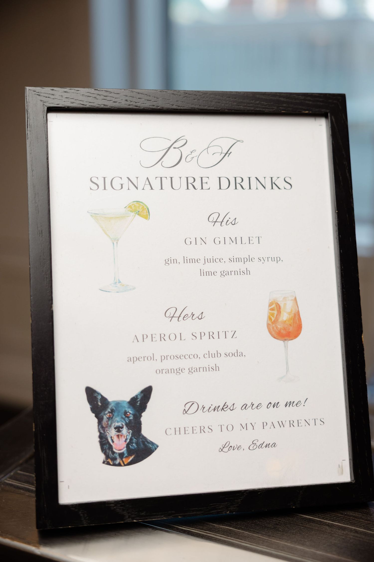 Wedding signature drink menu cards featuring cocktail illustrations and drink descriptions in elegant frames.