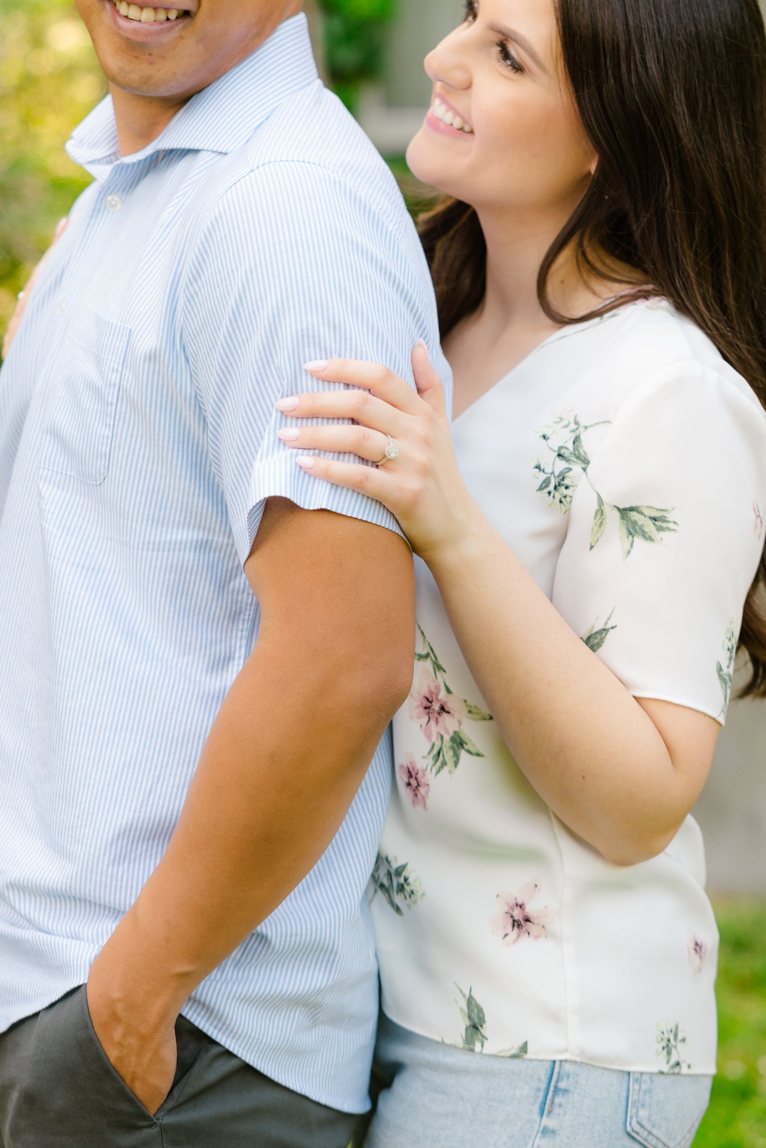 Close-up of couple in coordinating outfits sharing affectionate moment outdoors.